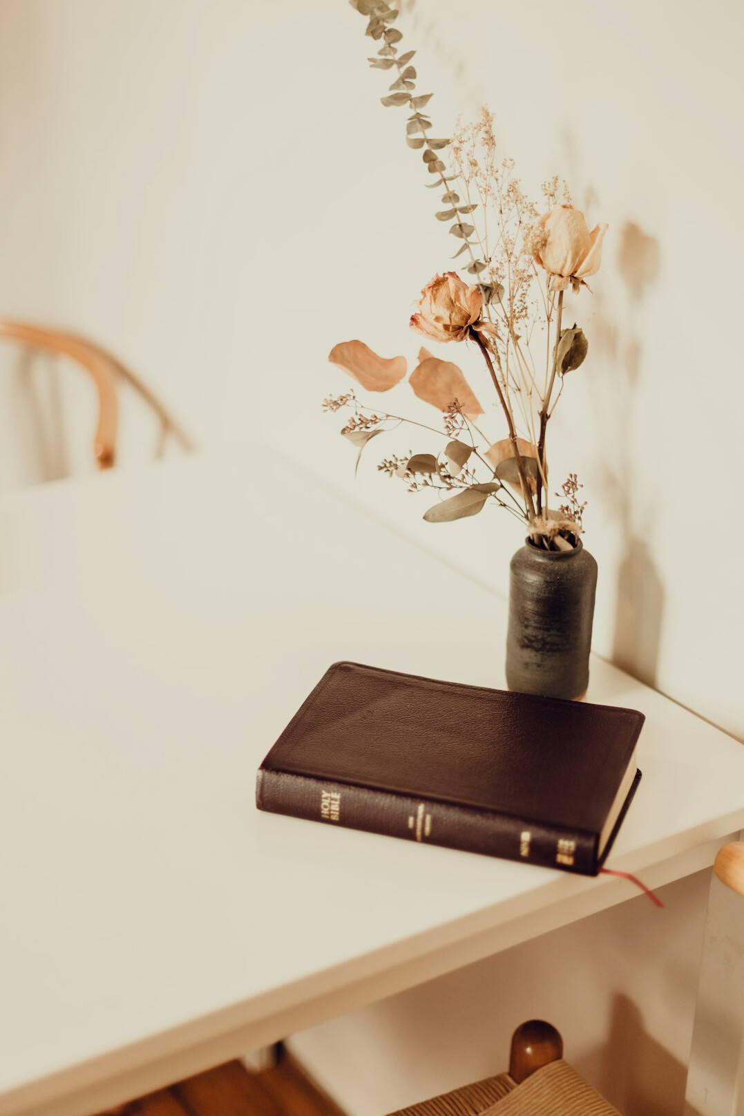 Open notebook and pen on a wooden desk